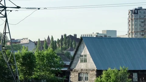 Wide shot of town approaches with old wooden house next to the high-rise Stock Footage 75850671