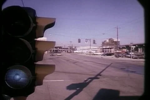 Wide shot of traffic light changing to red in small town Stock Footage 11366265