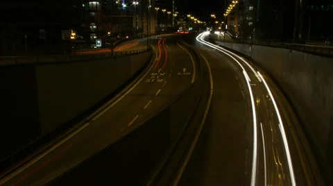 Wide shot of traffic speeding through Queensway tunnels in Birmingham. 库存影片 64709580
