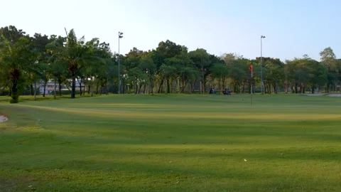 Wide Shot of Tropical Golf Course Green and Sand Bunker Stock Footage 337926057
