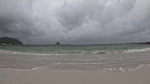 Wide shot of turquoise ocean waves washing white sand on Bleik Beach Norway Vídeos de archivo 343130560