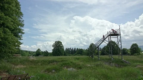 A wide shot of two bikers dropping in from a high start Stock Footage 107569429