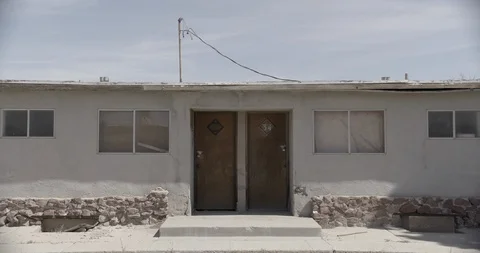 Wide Shot of Two Doors of an Abandoned Motel Stock Footage 89942865