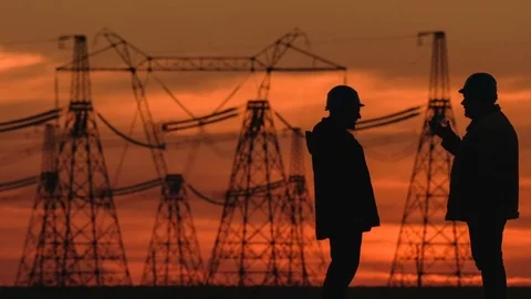 Wide shot of two engineers in hard hat vigorously discussing something at red Stock Footage 75633552