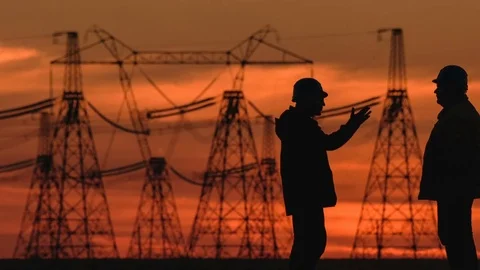 Wide shot of two engineers in hard hat vigorously discussing something at red Stock Footage 75634497