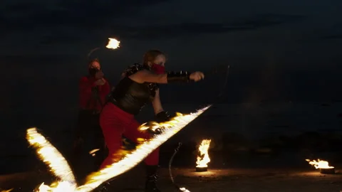 Wide shot of two fire artists performing their scene. Stock Footage 144745869