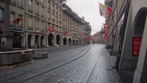 Wide shot of typical street during the day in Bern Old town with old fountain Stock Footage 337601646