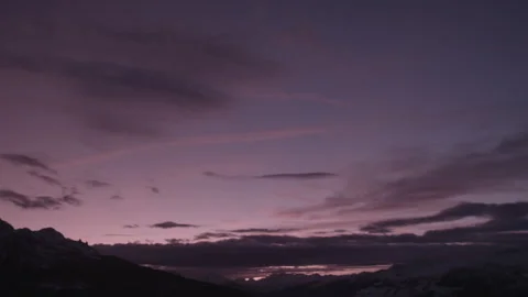 Wide Shot USA Sunset Clouds Over Snowy Mountain Peaks Twilight Atmospheric Stock Footage 329171490