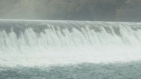 Wide Shot of a Waterfall on Misty Stream Stock Footage 138715541
