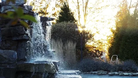 A Wide-Shot of a Waterfall at Sunset Stock Footage 69757491
