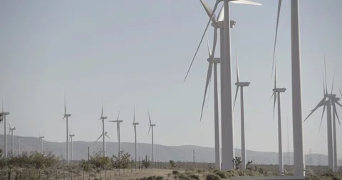 Wide Shot of Wind Mills Tilt Up Stock Footage 89942371
