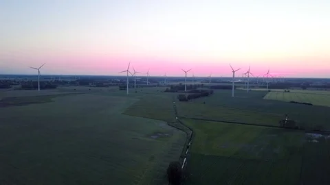 Wide shot of windmills and beautiful sunset drone aerial Stock Footage
