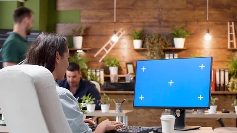 Wide shot of a woman working on a computer with isolated mock-up Stock Footage 112654635