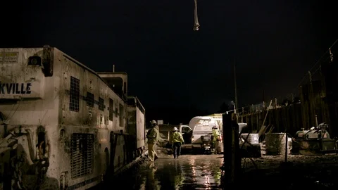 Wide Shot - Workers leaving Tunnel Construction Site Stock Footage 89980696