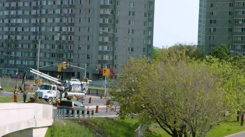 Wide shot- workers using a sewage flusher Stock-Footage 67422988