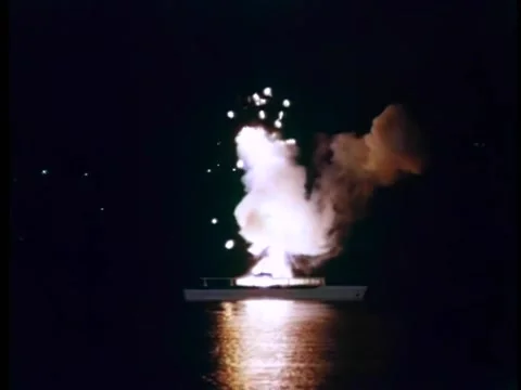 Wide shot of yacht exploding at night in port 库存影片 260254513