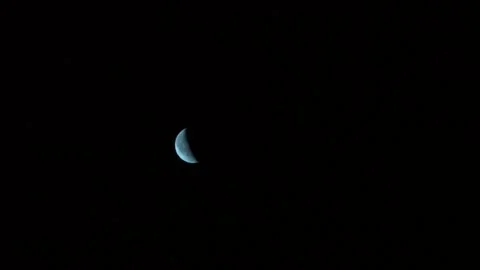 Wide shot to zoom in of half moon Stock Footage 248698711
