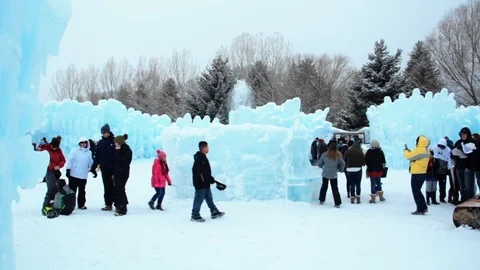 Wide Shots of Ice Castle Establish Families Kids People During Holiday in Winter Video stock 90366017
