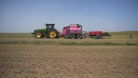 Wide - Side of Tractor and Bailor Stock-Footage 221861358