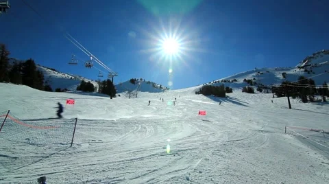 WIDE SKI RUN WITH SUN Stock Footage 1012321