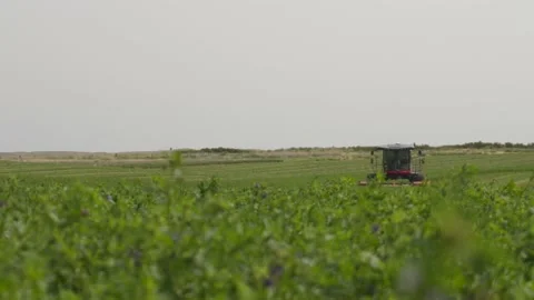 Wide Slide Right of a Swather Stock Footage 221863147