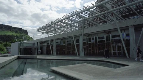 Wide Slow pan, Main visitor entrance to the Scottish Parliament, Edinburgh Stock Footage 79586293