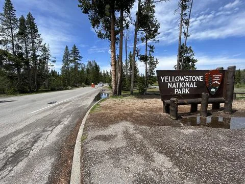 Wide of Southern Entrance to Yellowstone National Park with Road Closed Sign Stock Photos