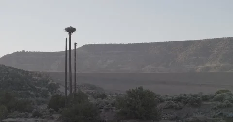 Wide static establishing shot of the road running along the dam in the San Ju Stock Footage 336220513