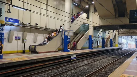 Wide Static Shot of Commuters on Escalator at Ayala MRT Station – Makati City Stock Footage 311425496