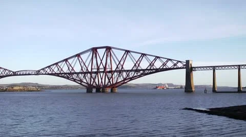 Wide static shot of train crossing Forth Rail Bridge Stock Footage 21894479