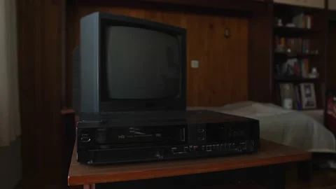 Wide static shot, vhs tape eject from old video recorder, retro wooden room 스톡 동영상 171235164