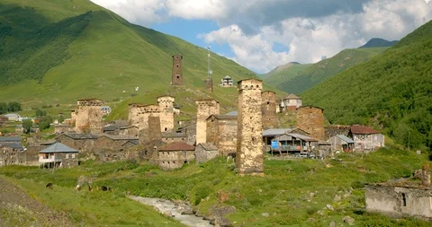 Wide static of Stone medieval fortified Svaneti tower houses of  Ushguli, Upper  Stock Footage 104416246