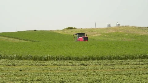 Wide Static of a Swather from Behind (3) Stock Footage 221863040