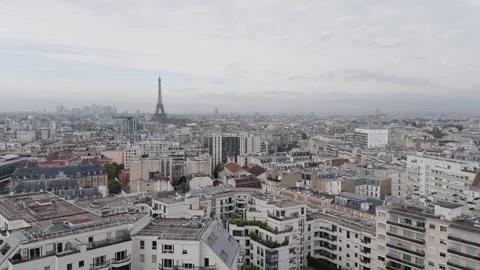 Wide static view of buildings in cloudy Paris, Eiffel Tower by horizon Stock Footage 290886697