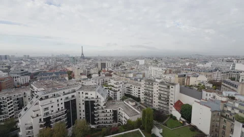 Wide static view of cloudy Paris skyline with Eiffel Tower by horizon Stock Footage 290881997