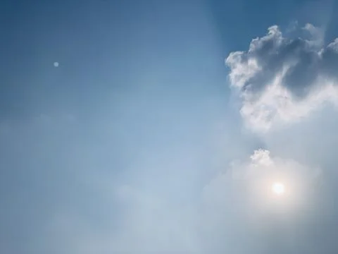 Wide Static View of Sun in Hazy Sky Over Jakarta Indonesia Stock Photos