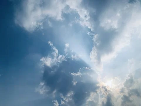 Wide Static View of Sun Rays and Clouds Over Jakarta Indonesia Stock Photos