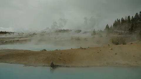 WIDE Steaming geyser pools within Geyser Basin in Yellowstone National Park Stock Footage 108629163