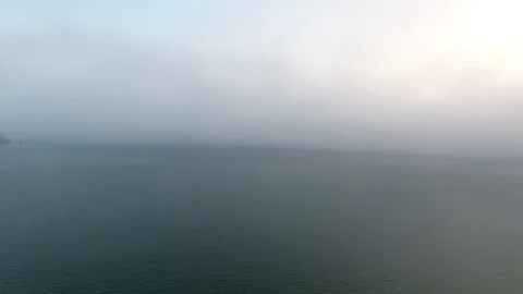 Wide still evening shot speeding across the calm waters of the Pacific Ocean Stock Footage 104062911