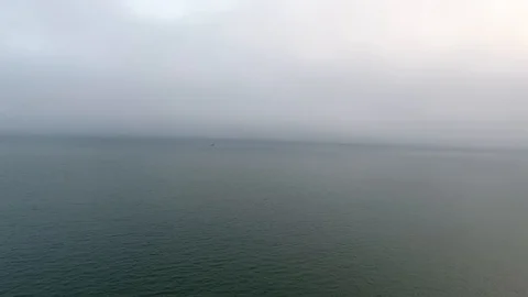 Wide still evening shot speeding across the calm waters of the Pacific Ocean Stock Footage 104065517
