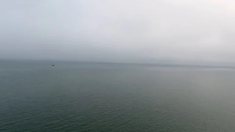 Wide still evening shot speeding across the calm waters of the Pacific Ocean Stock Footage 104066499