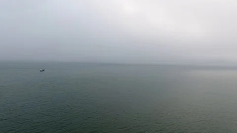 Wide still evening shot speeding across the calm waters of the Pacific Ocean Stock Footage 104066882