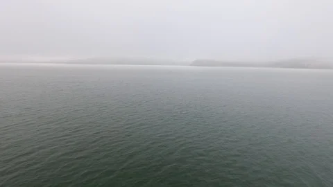 Wide still evening shot speeding across the calm waters of the Pacific Ocean Vídeo Stock 104078765