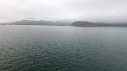 Wide still evening shot speeding across the calm waters of the Pacific Ocean Stock-Footage 104079960
