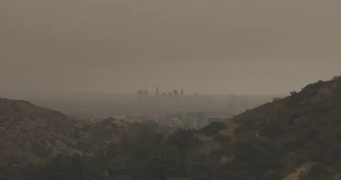 A Wide Still Shot of Orange Skies over Downtown LA Covered in Smoke from Fires Stock Footage 139781453