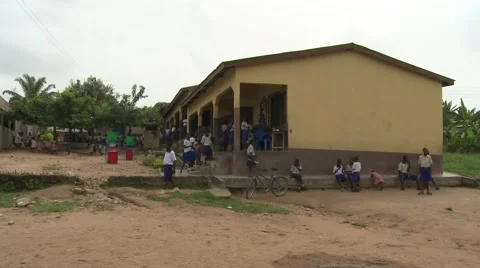 WIDE: STUDENTS PLAYING - PAN TO STUDENTS IN FRONT OF NEW SANITATION FACILITY Stock Footage 60116125