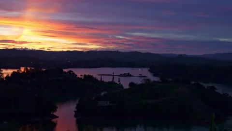 Wide Sunset Panorama Over Guatape Reservoir and Hills Video stock 345046489