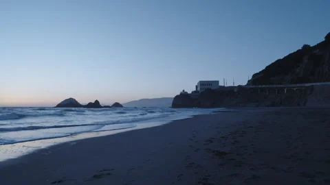 Wide Sunset View of Bird Rock, Sand, and Cliff House – Ocean Beach San Francisco Vídeo Stock 310337567