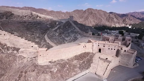 A wide, sweeping drone shot of Samail Fort Stock Footage 338238566