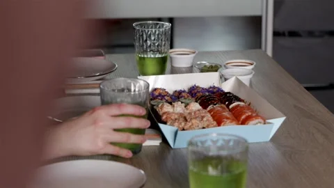 Wide table setting with large sushi set and fresh lemonade for friendly gat.. Video stock 344877092